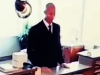 Footage of a men in black agent in an office, one of many scary videos.